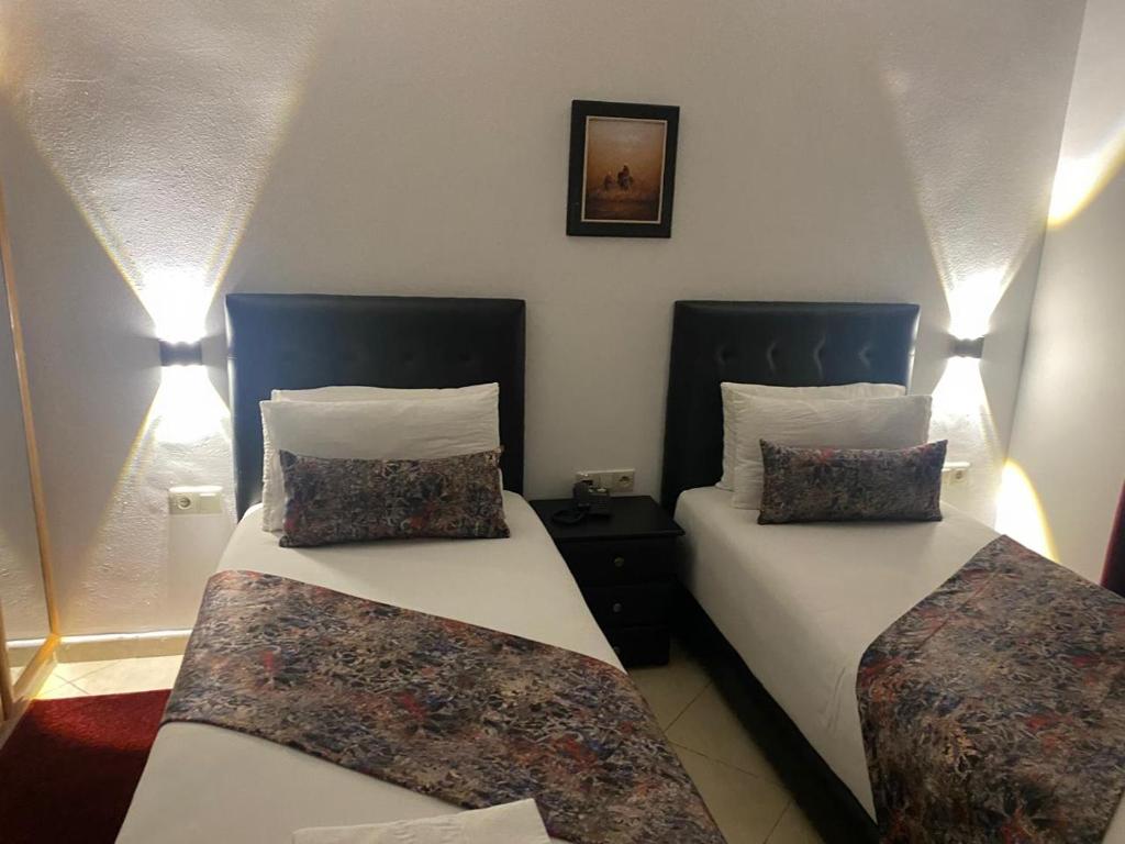 Postel nebo postele na pokoji v ubytování Hotel Miramar