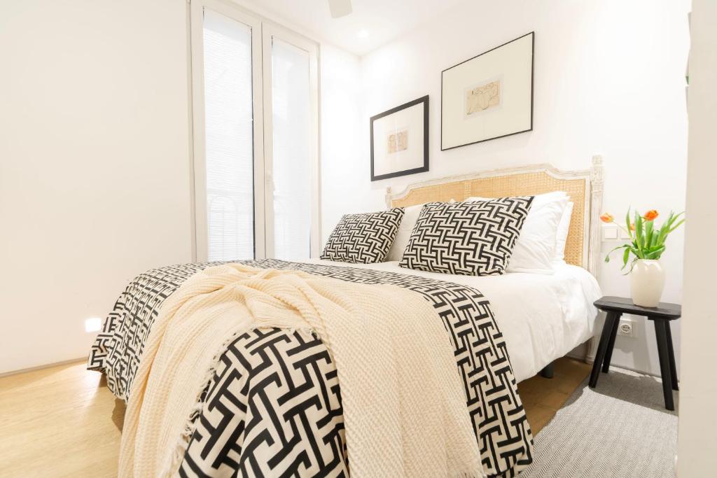 A bed or beds in a room at 8 balconies Heart of the old town