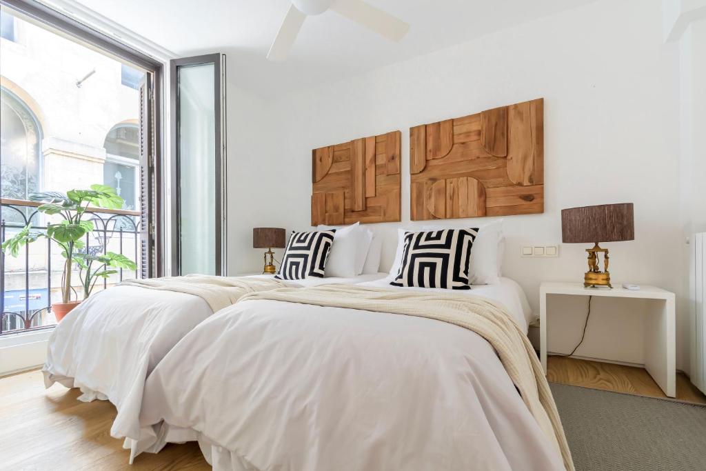 A bed or beds in a room at 8 balconies Heart of the old town