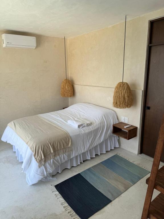 Een bed of bedden in een kamer bij La Calita de Teques