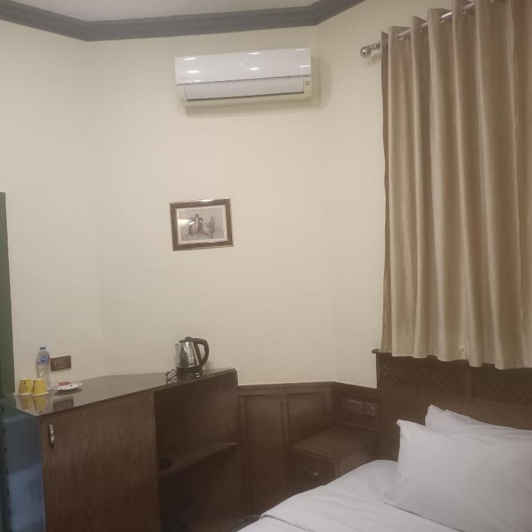 Postel nebo postele na pokoji v ubytování Carlton Downtown Cairo