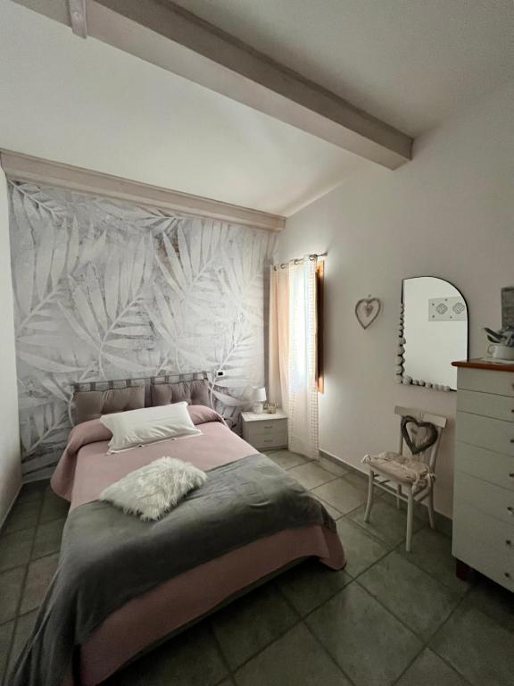Postel nebo postele na pokoji v ubytování B&B Roseddu