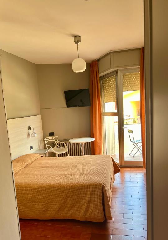 Postel nebo postele na pokoji v ubytování Hotel Astoria