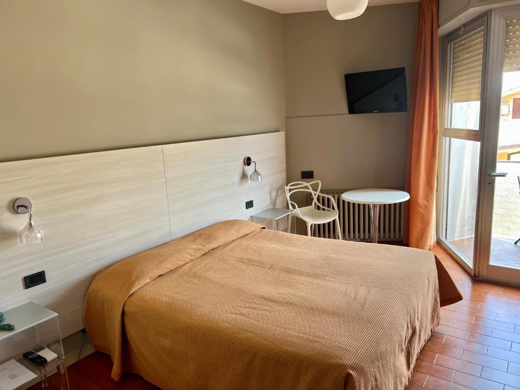 Postel nebo postele na pokoji v ubytování Hotel Astoria