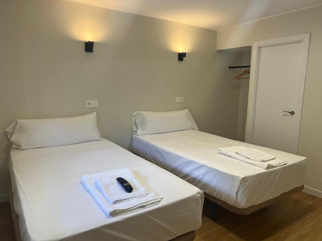 Letto o letti in una camera di Hostal Mindanao
