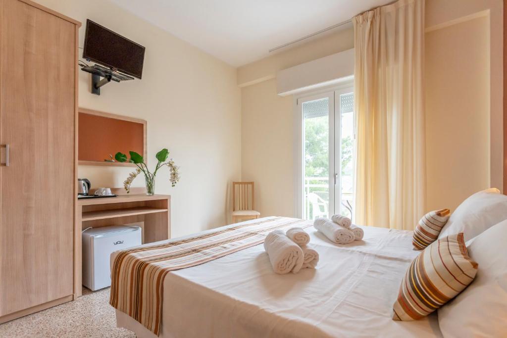 Postel nebo postele na pokoji v ubytování Hotel Cormoran Riccione