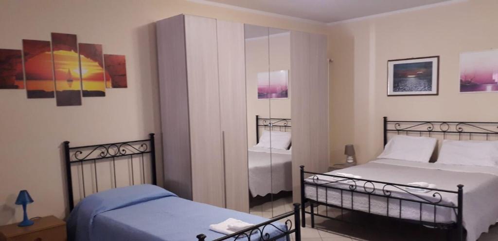 Posteľ alebo postele v izbe v ubytovaní casa vacanze iris, appartamento turistico