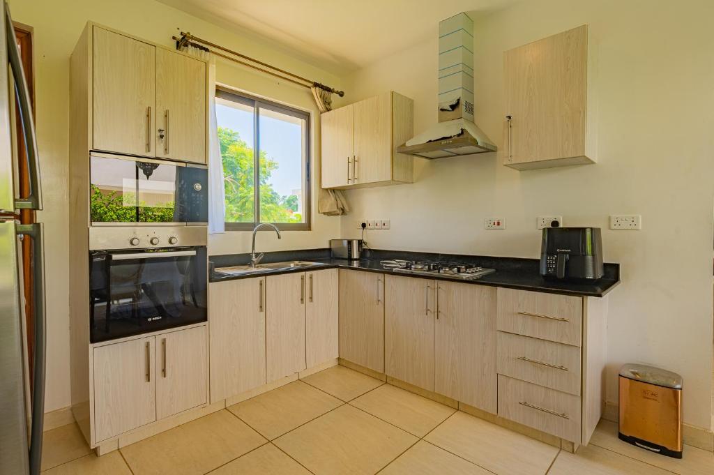 Kuchyň nebo kuchyňský kout v ubytování Insigma Kuza Villas
