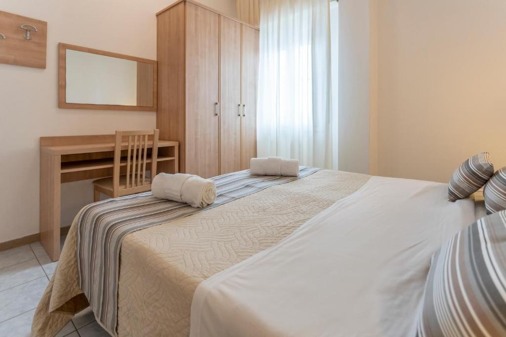Postel nebo postele na pokoji v ubytování Hotel Cormoran Riccione