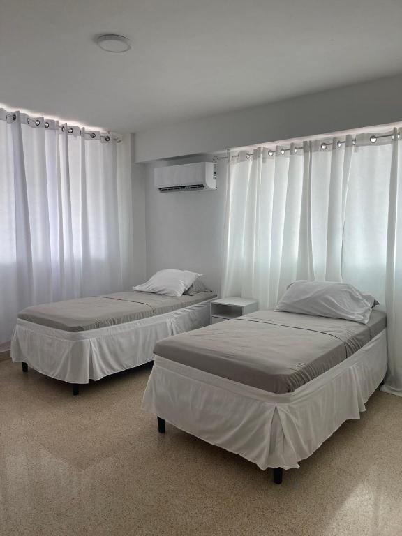 Postel nebo postele na pokoji v ubytování Habitaciones privadas en un departamento encantador