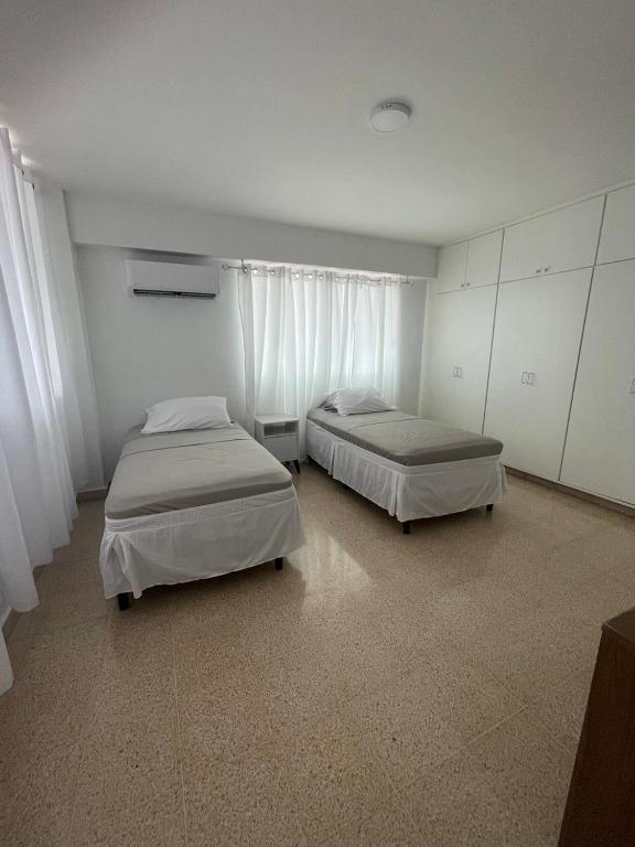 Postel nebo postele na pokoji v ubytování Habitaciones privadas en un departamento encantador