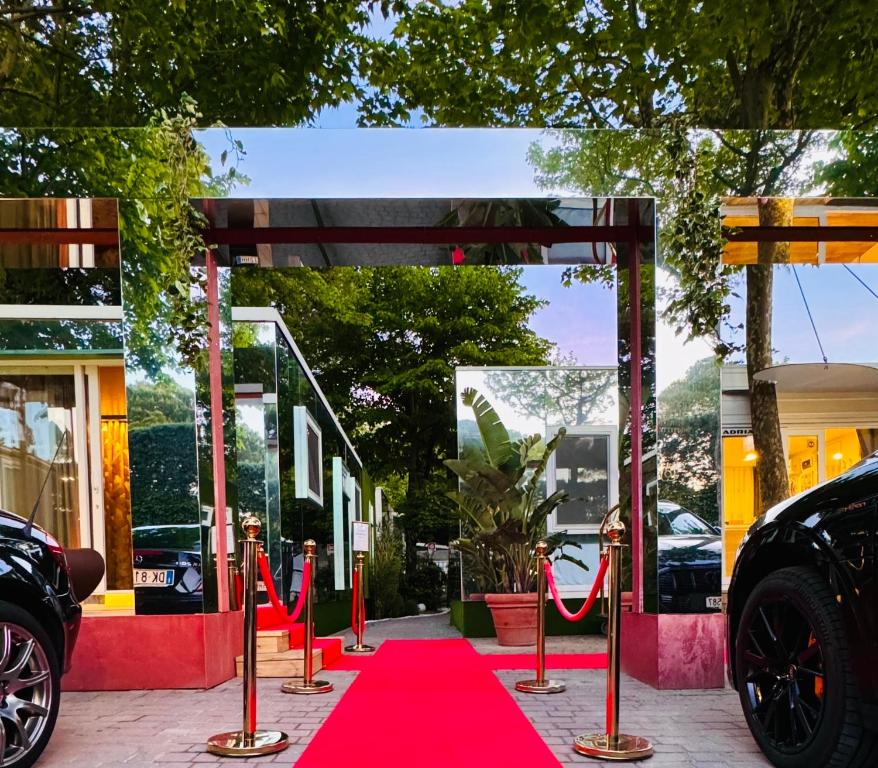 a red carpet on a sidewalk in front of a store at Luxury Camp at Union Lido in Cavallino-Treporti