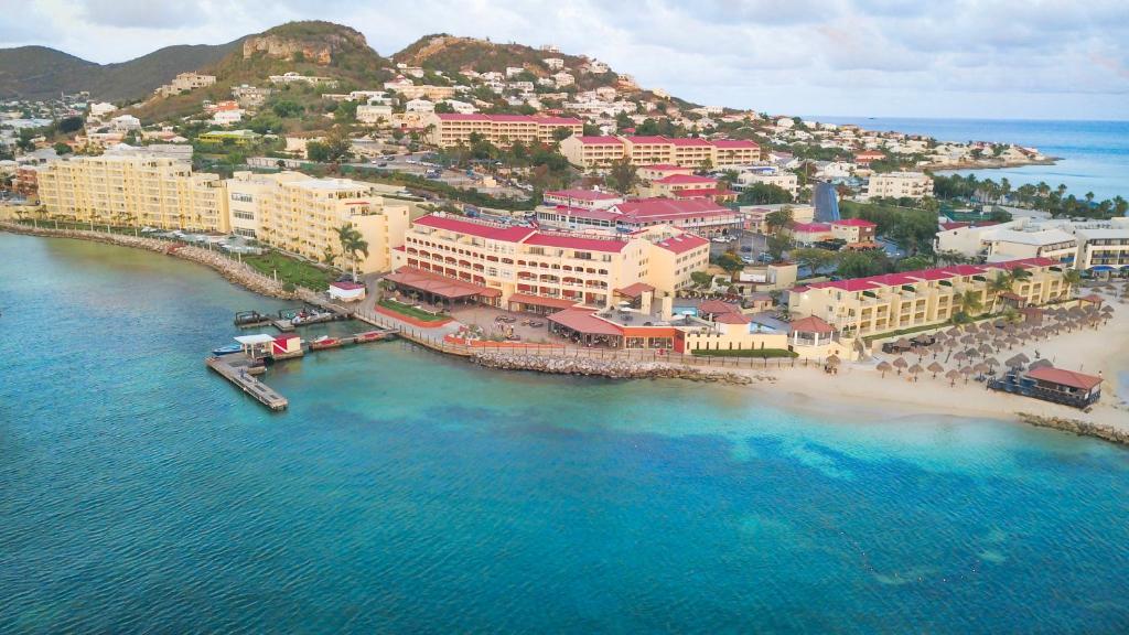 an aerial view of a beach with buildings and the ocean at Simpson Bay Resort Marina & Spa in Simpson Bay