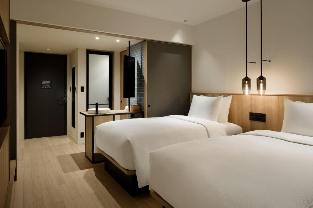 Postel nebo postele na pokoji v ubytování Fairfield by Marriott Mie Okuise Odai
