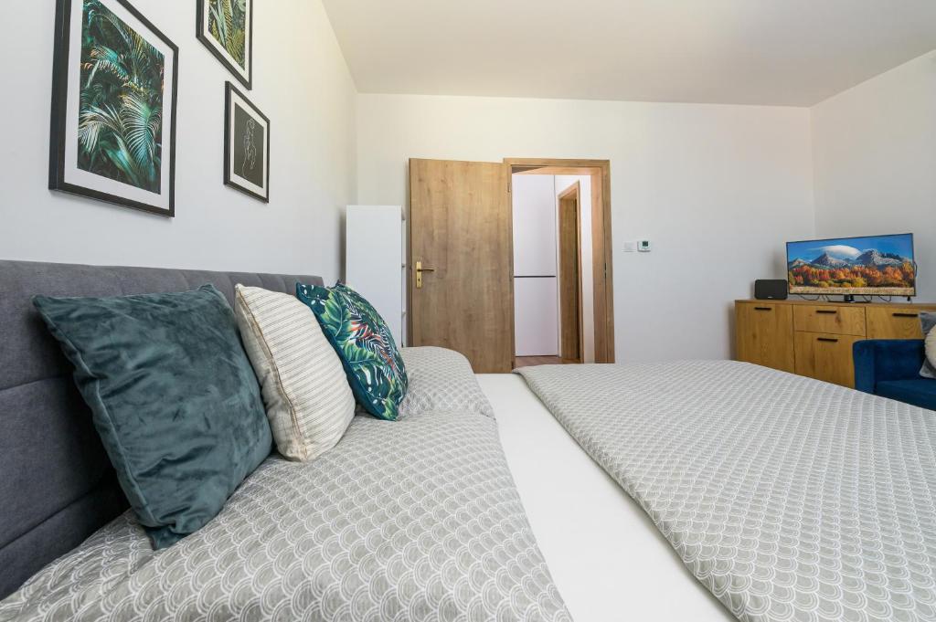 Posteľ alebo postele v izbe v ubytovaní Apartmán Martin