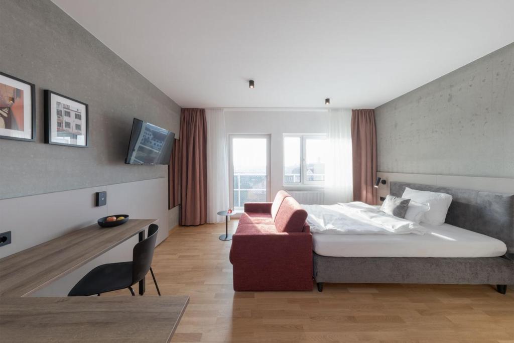 Postel nebo postele na pokoji v ubytování Brera Serviced Apartments Singen