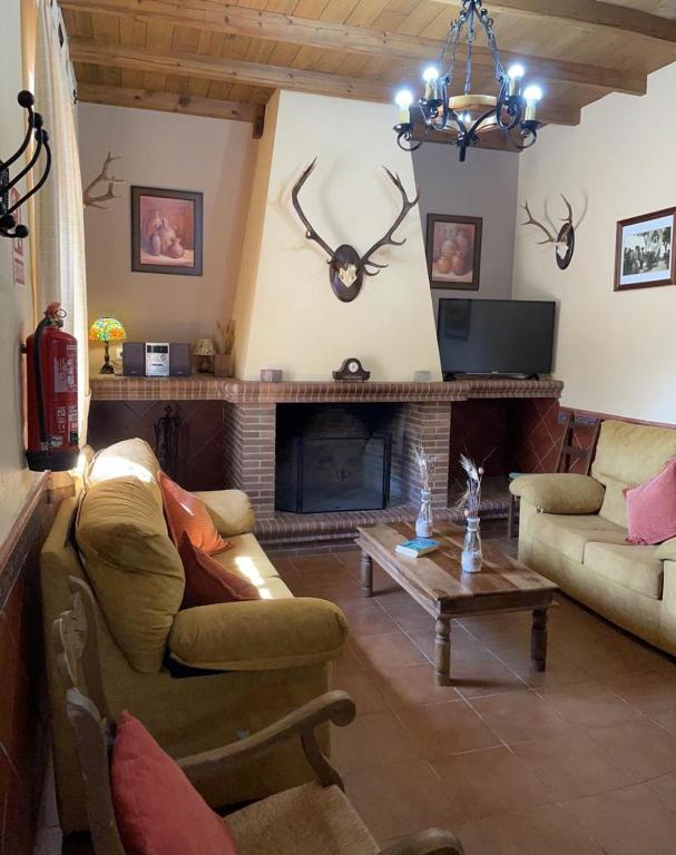 A television and/or entertainment centre at CASA RURAL LA DEHESILLA