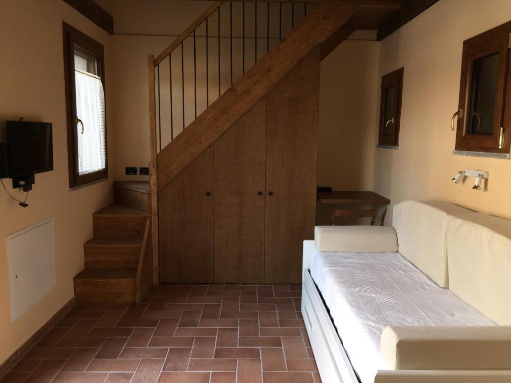 Postel nebo postele na pokoji v ubytování Cascina Battivacco
