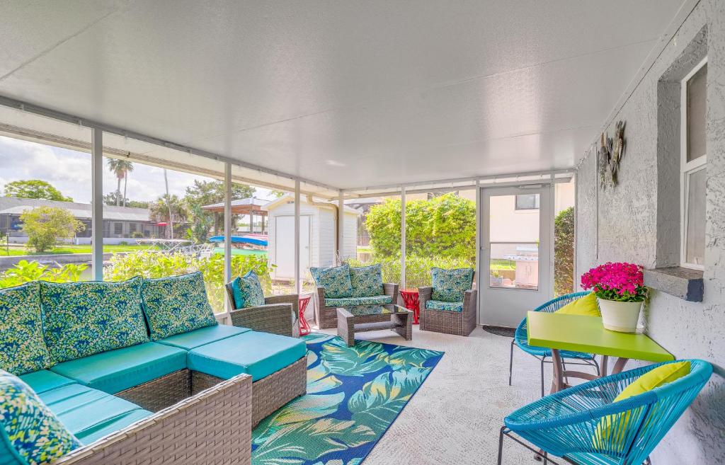 a patio with a couch and chairs and a table at Crystal River Getaway with Dock, Kayaks and Bicycles! in Crystal River