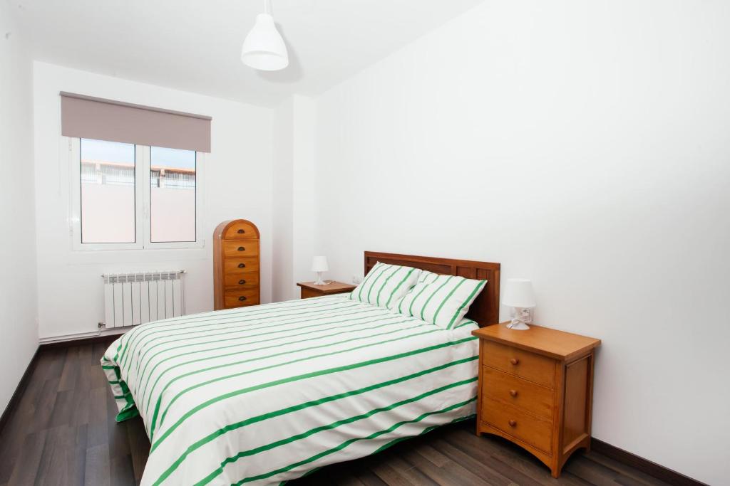 Postel nebo postele na pokoji v ubytování Apartamentos Florida 30