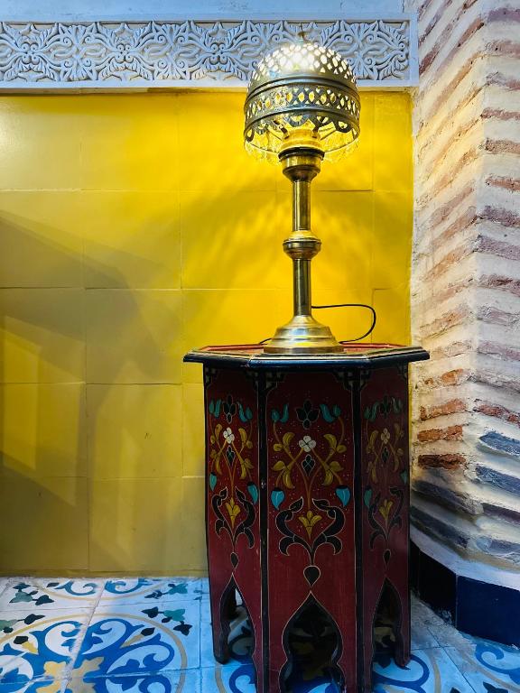 a table with a trophy on top of it at Riad Al Nour in Marrakech