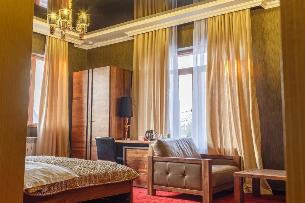 Postel nebo postele na pokoji v ubytování Astor Hotel & Spa