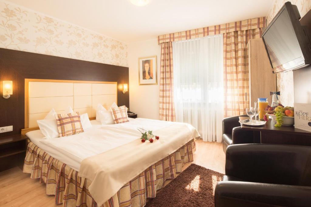 Postel nebo postele na pokoji v ubytování Central Boutique Hotel