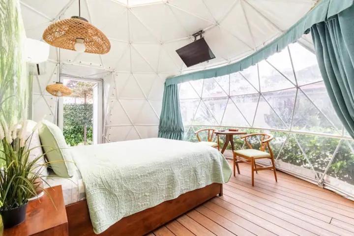 Postel nebo postele na pokoji v ubytování Ubuntu Glamping