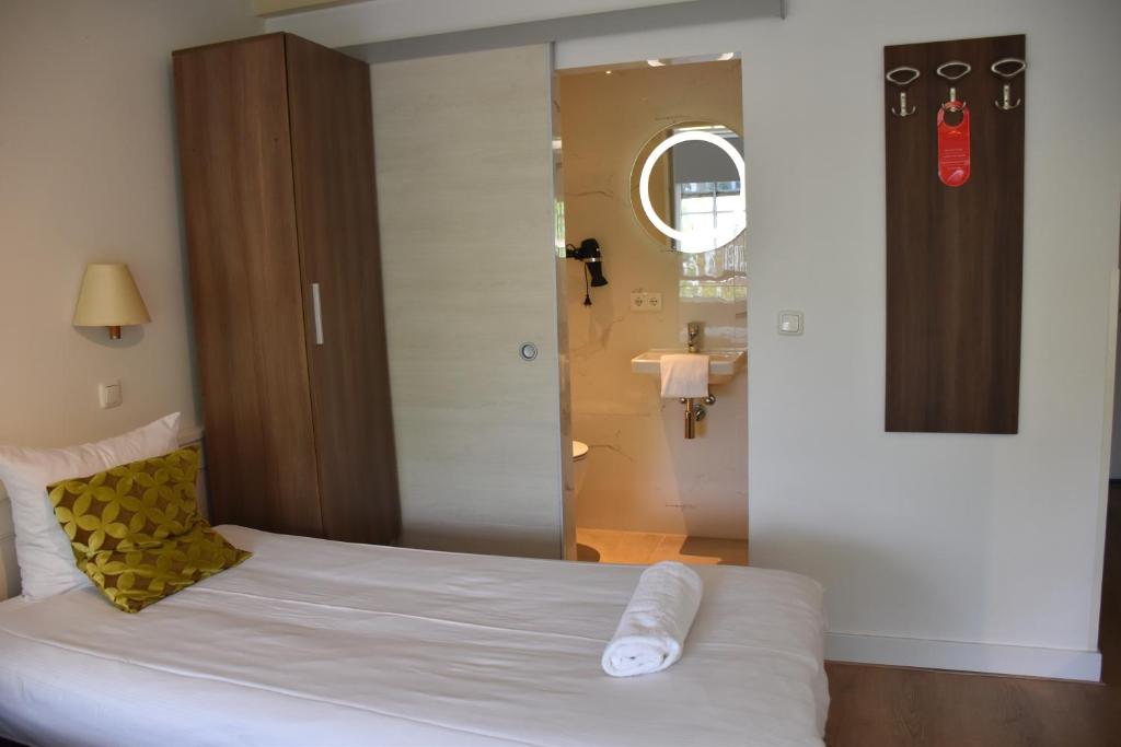 Postel nebo postele na pokoji v ubytování ITC Hotel