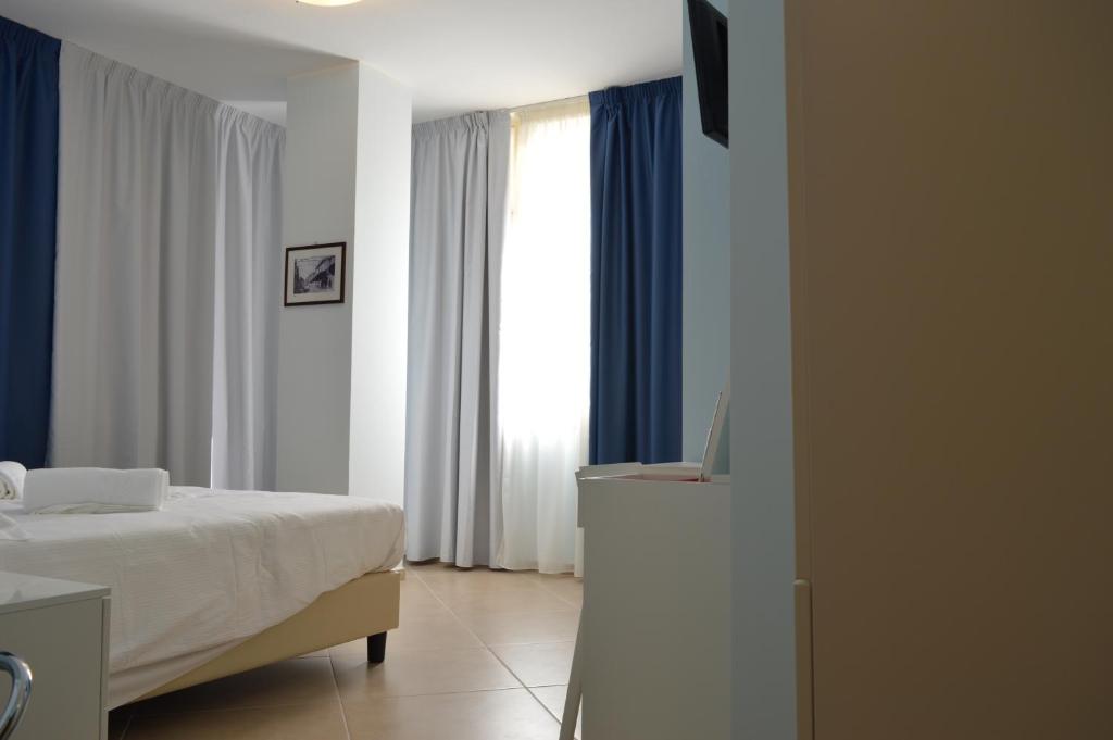 Posteľ alebo postele v izbe v ubytovaní B&b Bagheria