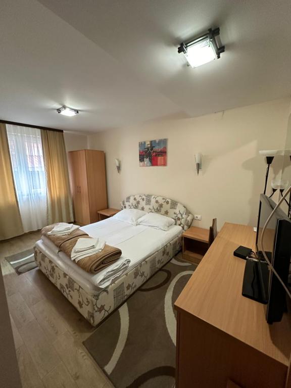 Postel nebo postele na pokoji v ubytování Vila Veljković - Sobe & apartmani " Ljupče "