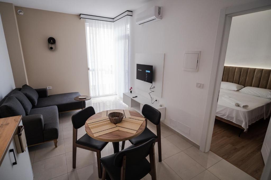 Postel nebo postele na pokoji v ubytování FUYA Apartments