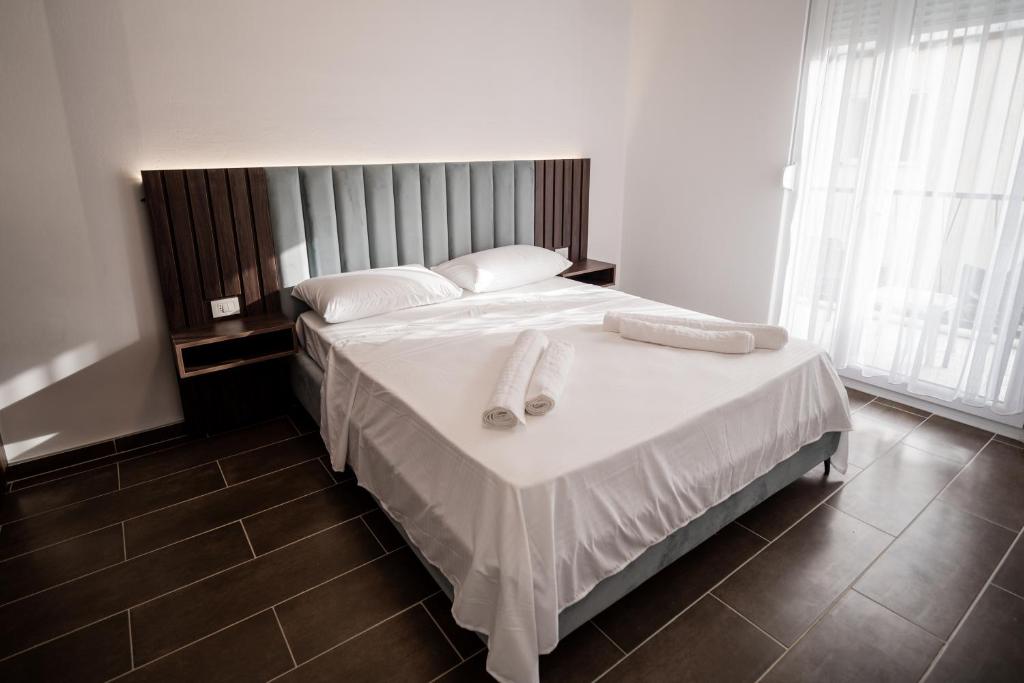 Postel nebo postele na pokoji v ubytování FUYA Apartments