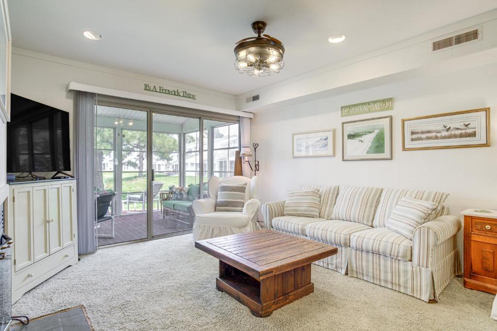 a living room with a couch and a table at 2 Mi to Beach Gem with Enclosed Patio in Selbyville in Selbyville