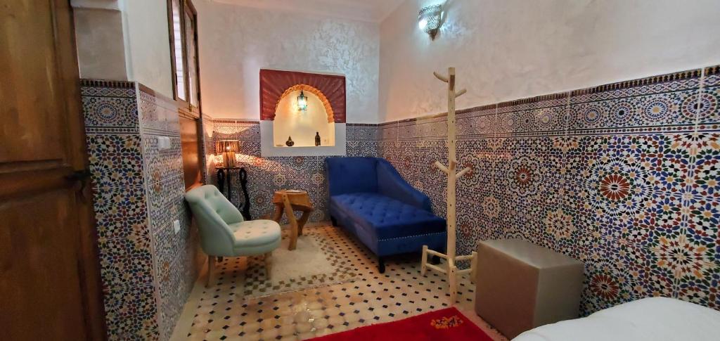 Postel nebo postele na pokoji v ubytování Riad Dar Si Driss