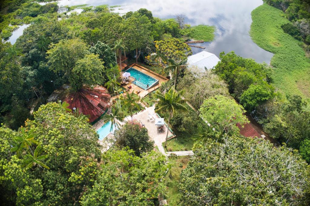 an aerial view of a house in the forest at Amazonia Jungle Hotel in Iranduba