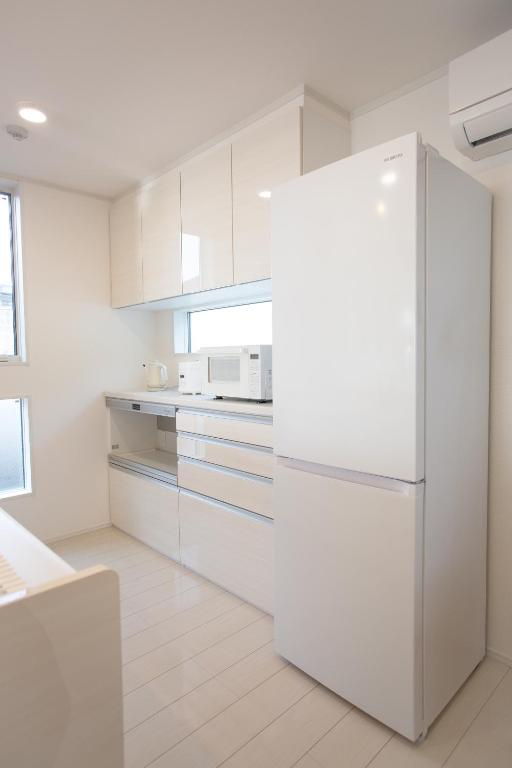Kuchyň nebo kuchyňský kout v ubytování Ashina Bayfront Villa