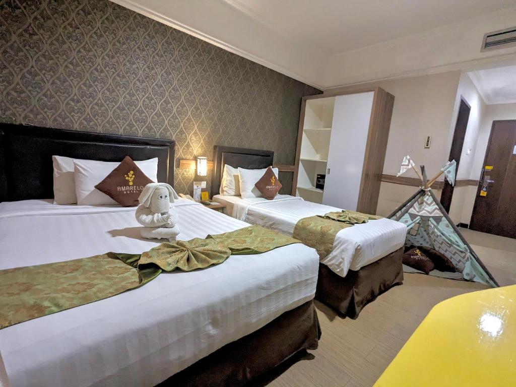 Cama o camas de una habitación en Amarelo Hotel Solo
