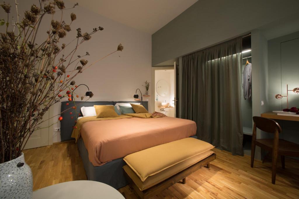 a hotel room with a bed and a table and a desk at B&B Santa Maria del Fiore in Florence