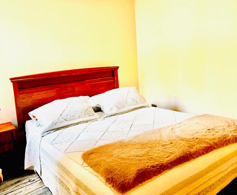 מיטה או מיטות בחדר ב-Departamento Temuco Full Equipado