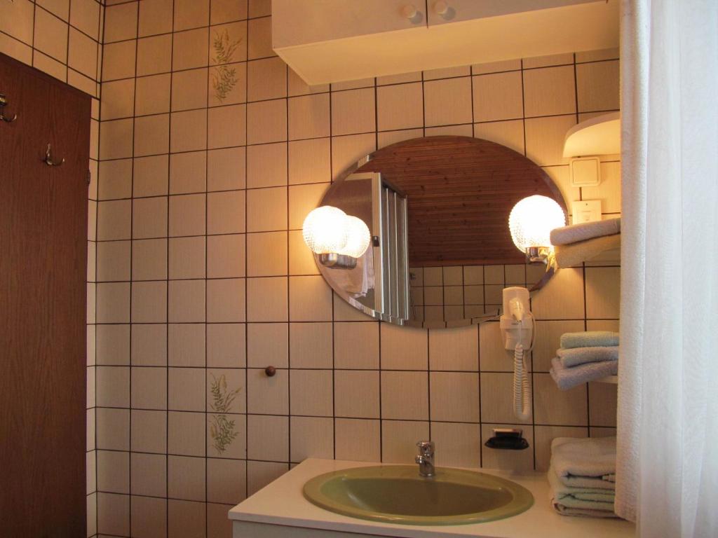 a bathroom with a sink and a mirror at Appartement Weingut Schoberhof in Bad Gleichenberg
