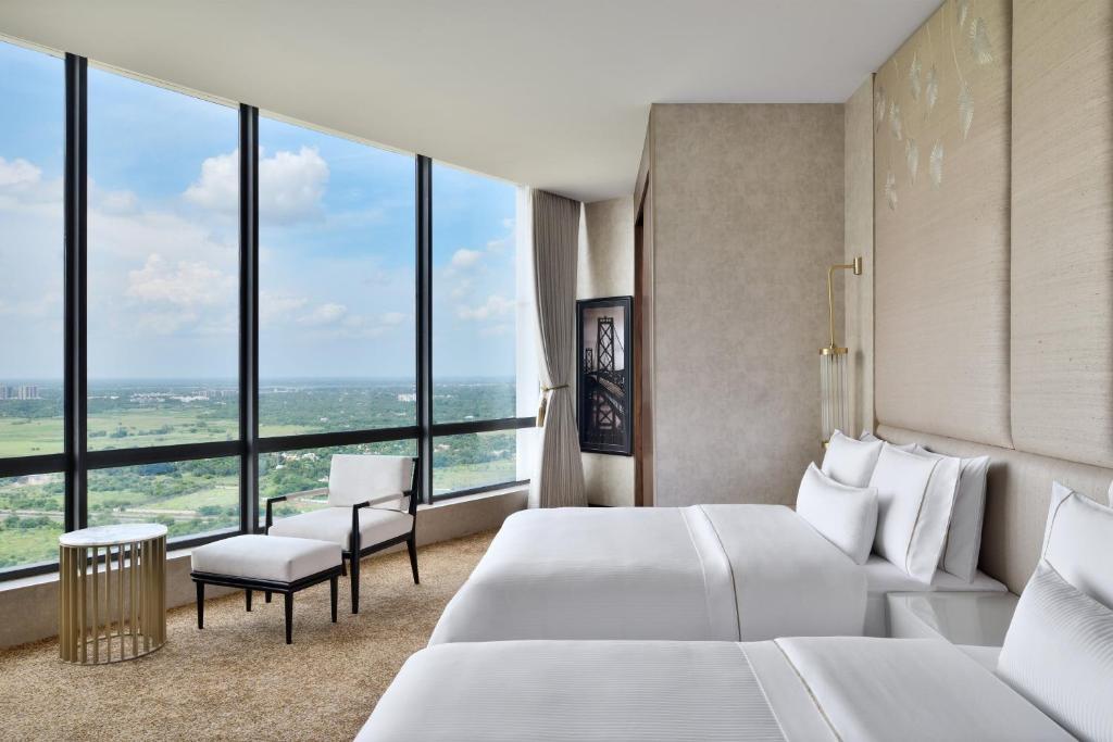 Postel nebo postele na pokoji v ubytování The Westin Kolkata Rajarhat