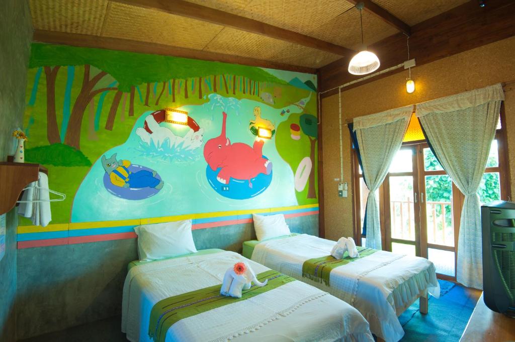 Postel nebo postele na pokoji v ubytování Baan Chokdee Pai Resort