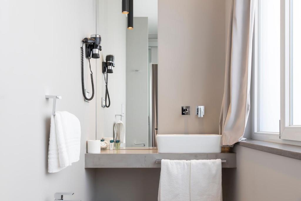 a bathroom with a sink and a mirror at Milestone in Quartu SantʼElena