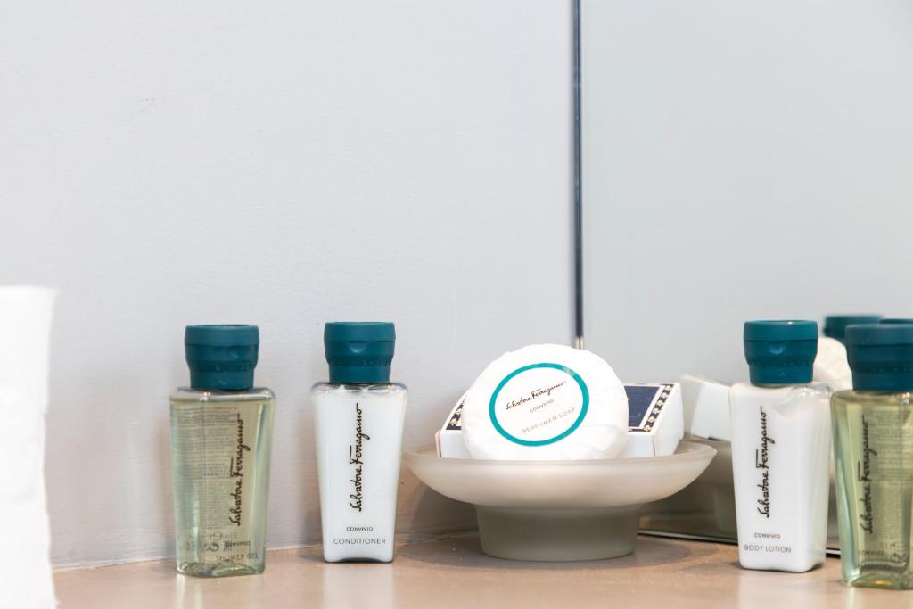 a group of bottles of hair products on a counter at Milestone in Quartu SantʼElena