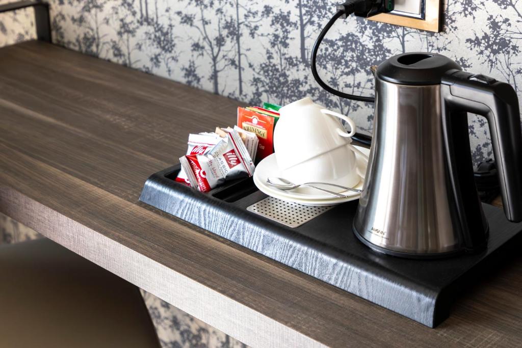 a tea kettle is sitting on a table at Milestone in Quartu SantʼElena