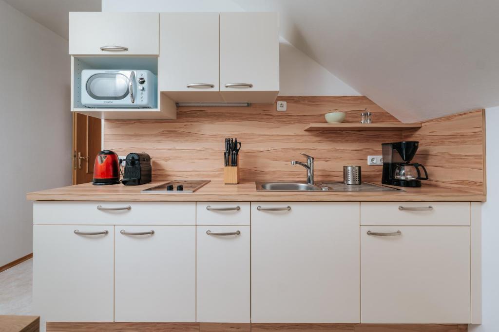 Kuchyň nebo kuchyňský kout v ubytování Ferienwohnung Syen