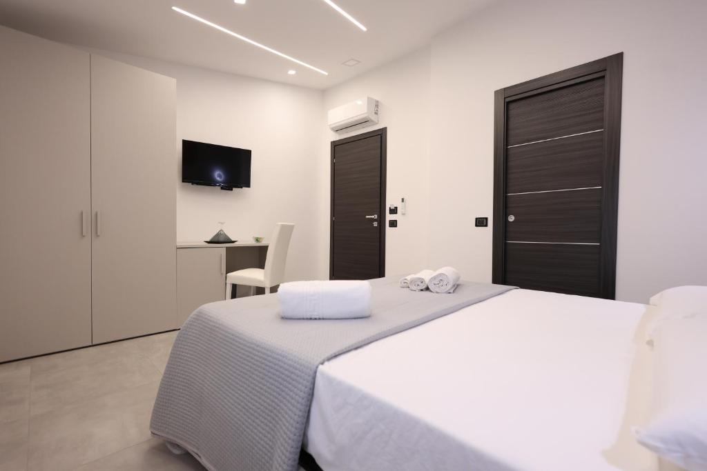 Postel nebo postele na pokoji v ubytování B&B Sunlight Tropea