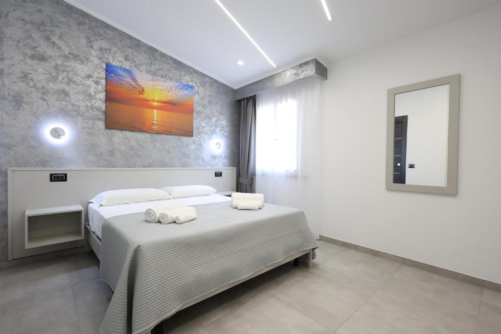 Postel nebo postele na pokoji v ubytování B&B Sunlight Tropea