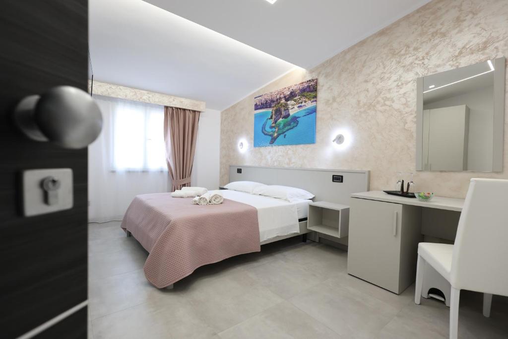 Postel nebo postele na pokoji v ubytování B&B Sunlight Tropea